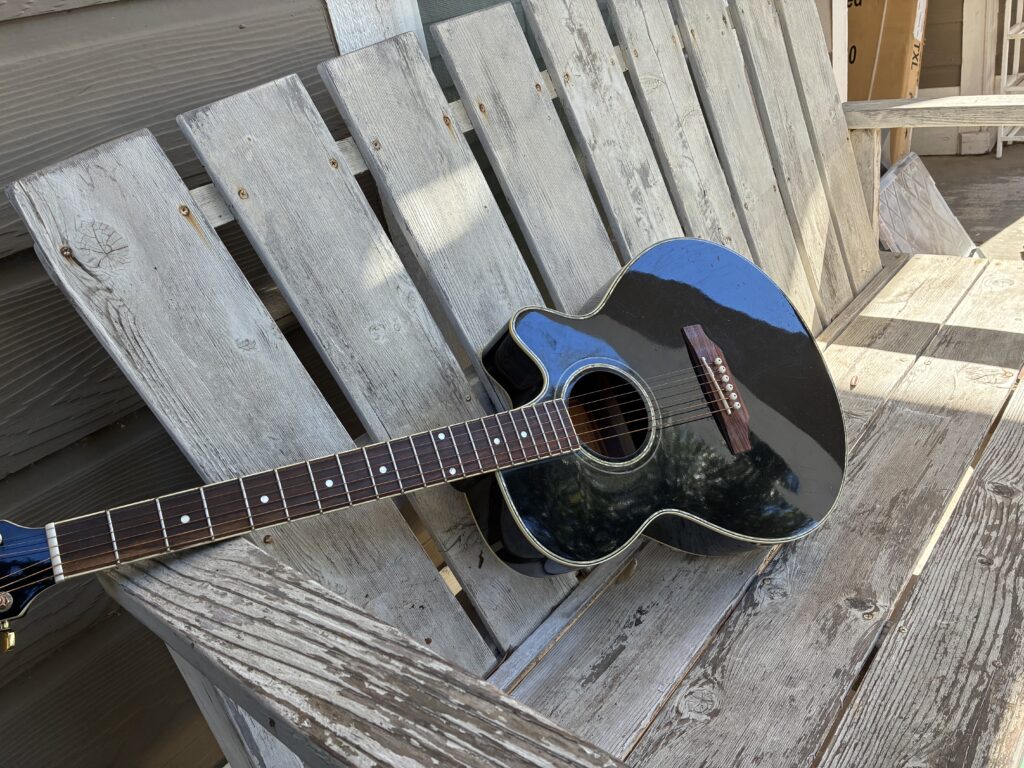 Picture of Guitar on porch bench